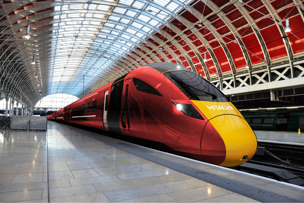 A red and yellow Hitachi high-speed train at a station platform — Hitachi Europe case study